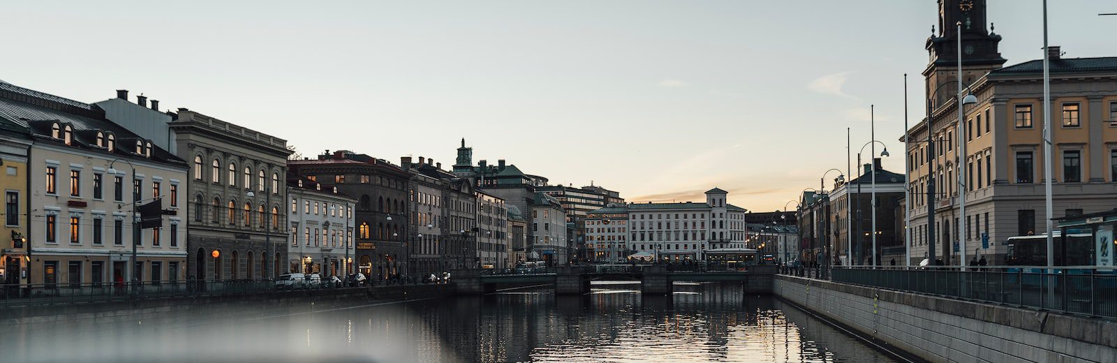 river surrounded by concrete buildings during daytime